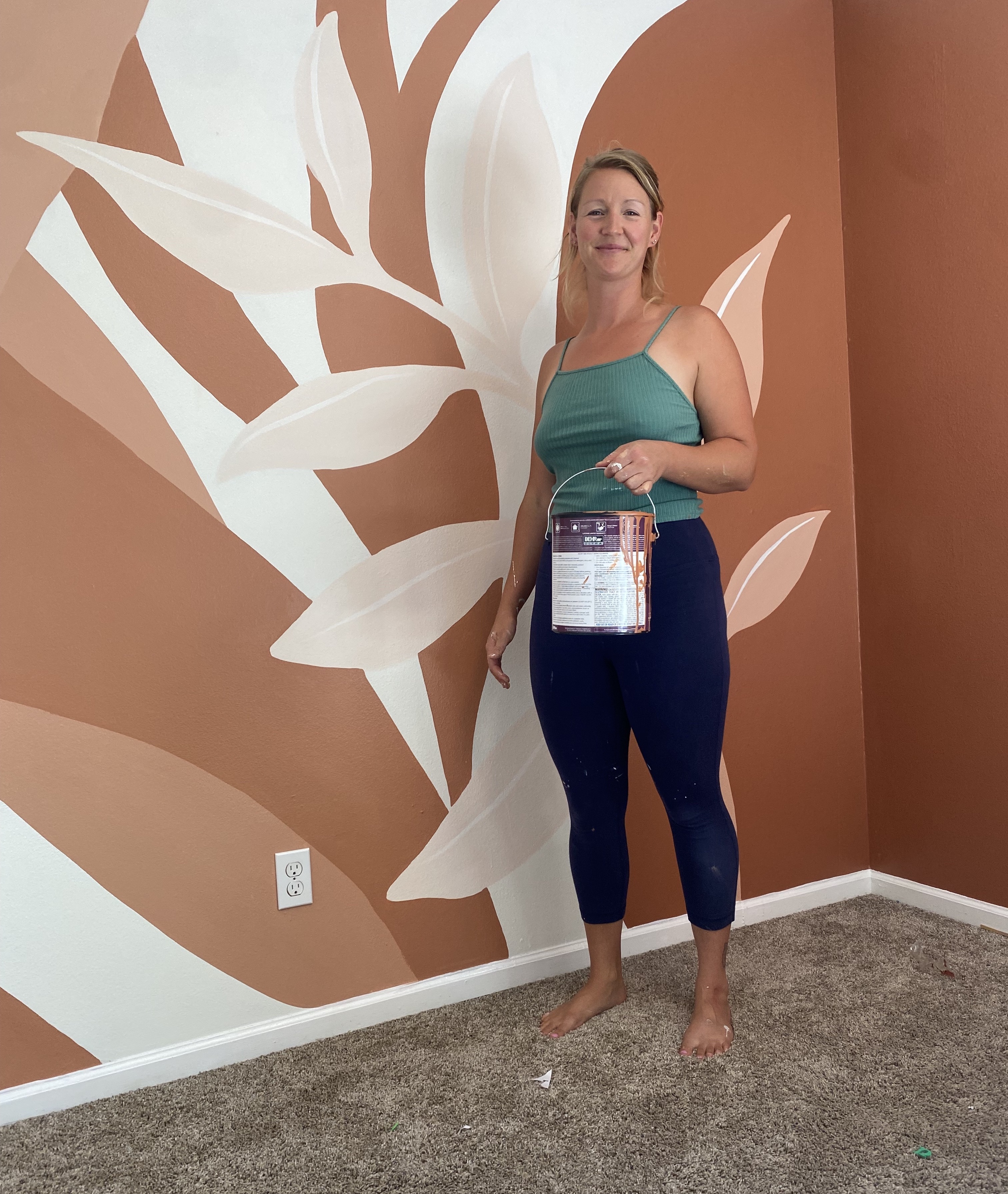 Colorado woman painting Aurora house mural